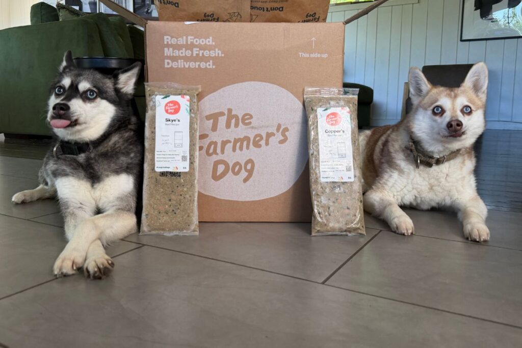 Skye and Copper pose next to The Farmer's Dog in April 2026